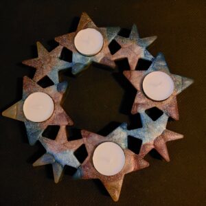 Unieke sterren krans voor 4 waxinelichtjes.