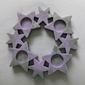 Unieke sterren krans voor 4 waxinelichtjes.