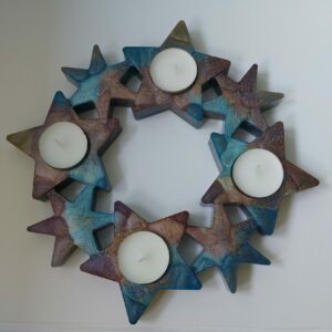 Unieke sterren krans voor 4 waxinelichtjes.