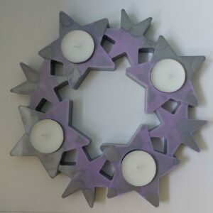 Unieke sterren krans voor 4 waxinelichtjes.