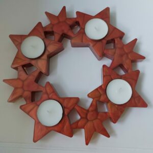 Unieke sterren krans voor 4 waxinelichtjes.