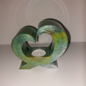 Waxinelichthouder in bijzondere vorm. Dubbelzijdig te gebruiken.