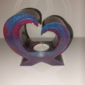 Waxinelichthouder in bijzondere vorm. Dubbelzijdig te gebruiken.